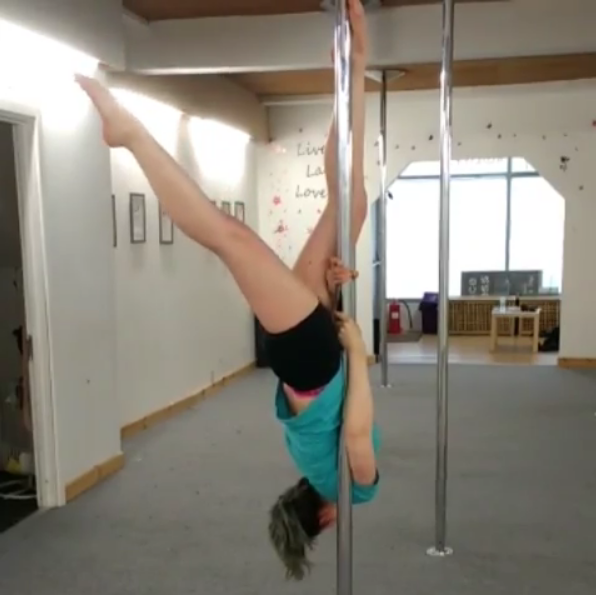 Pip defies gravity at a Pole Fitness session.